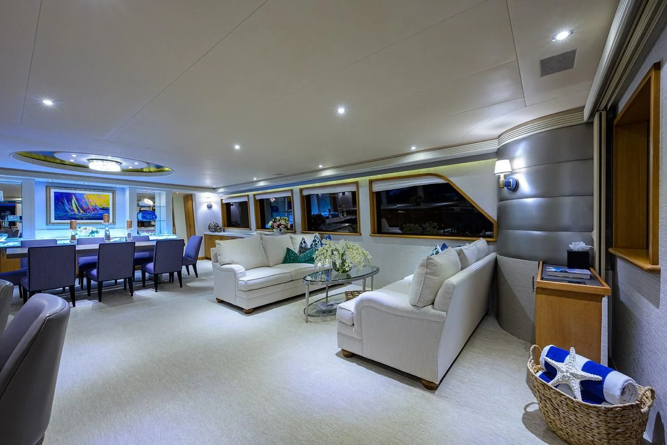 a living room with a couch and a television aboard SUPERSTAR Yacht for Charter