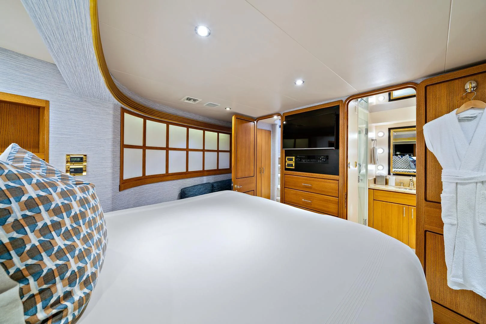 a bedroom with a bed and a microwave aboard SUPERSTAR Yacht for Charter