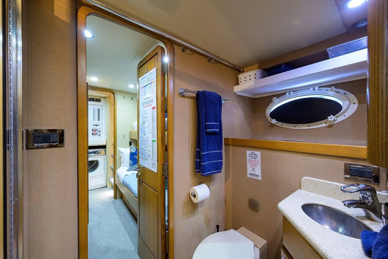 a bathroom with a sink and a toilet aboard SUPERSTAR Yacht for Charter