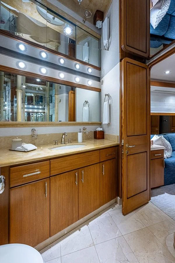 a bathroom with a large mirror aboard SUPERSTAR Yacht for Charter