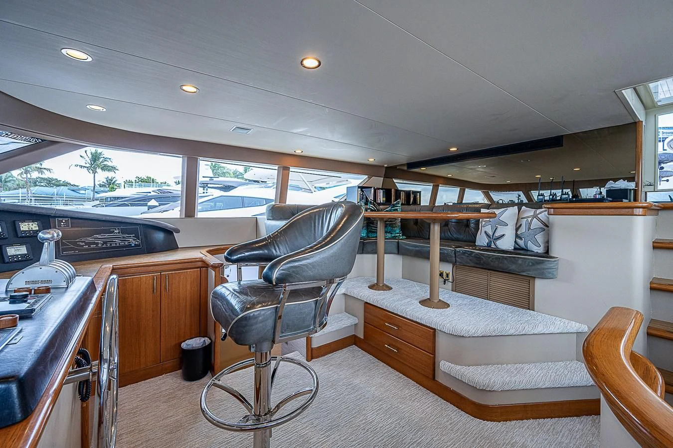 a room with a chair and a table and a bed aboard SUPERSTAR Yacht for Charter