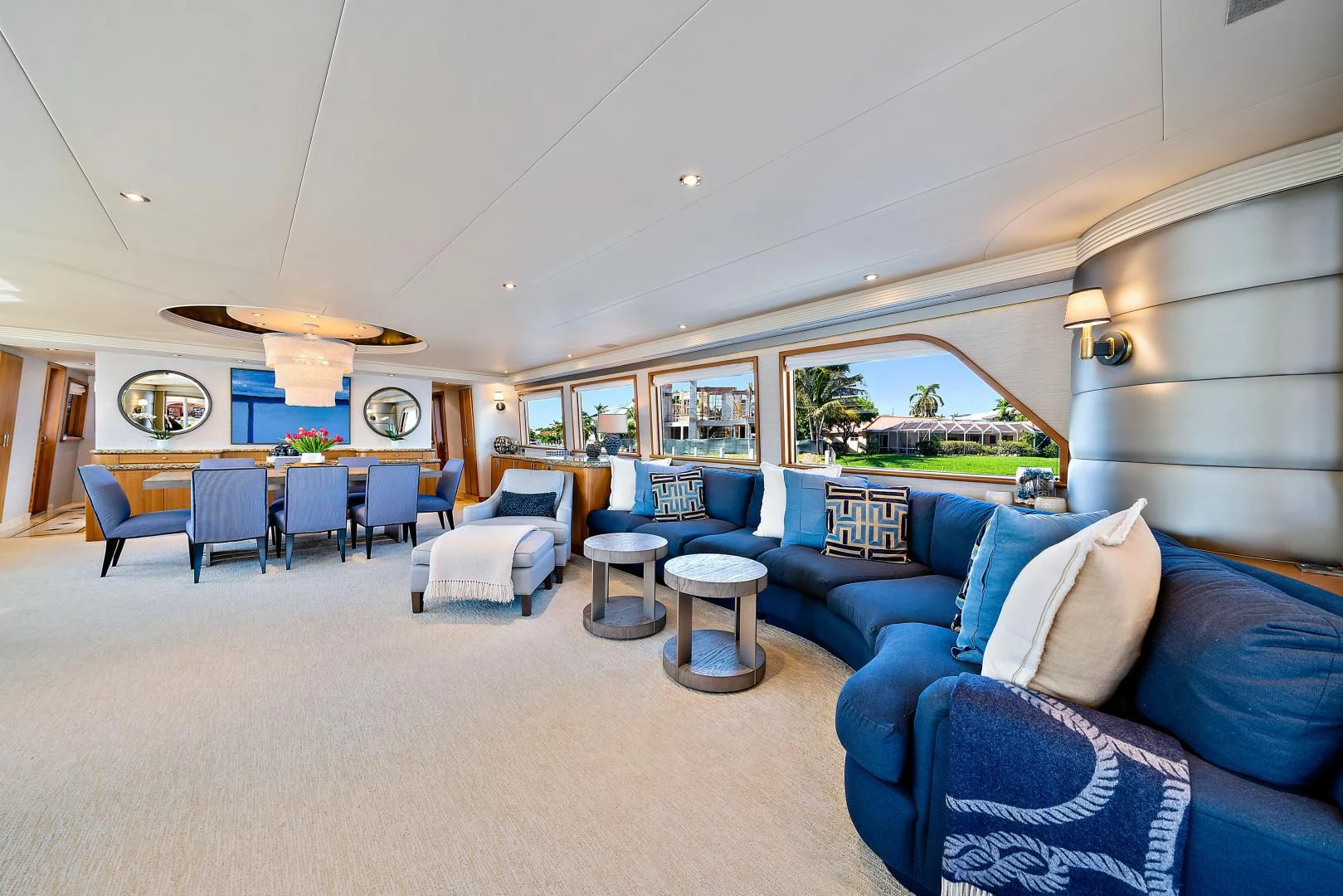 a living room with blue couches aboard SUPERSTAR Yacht for Charter
