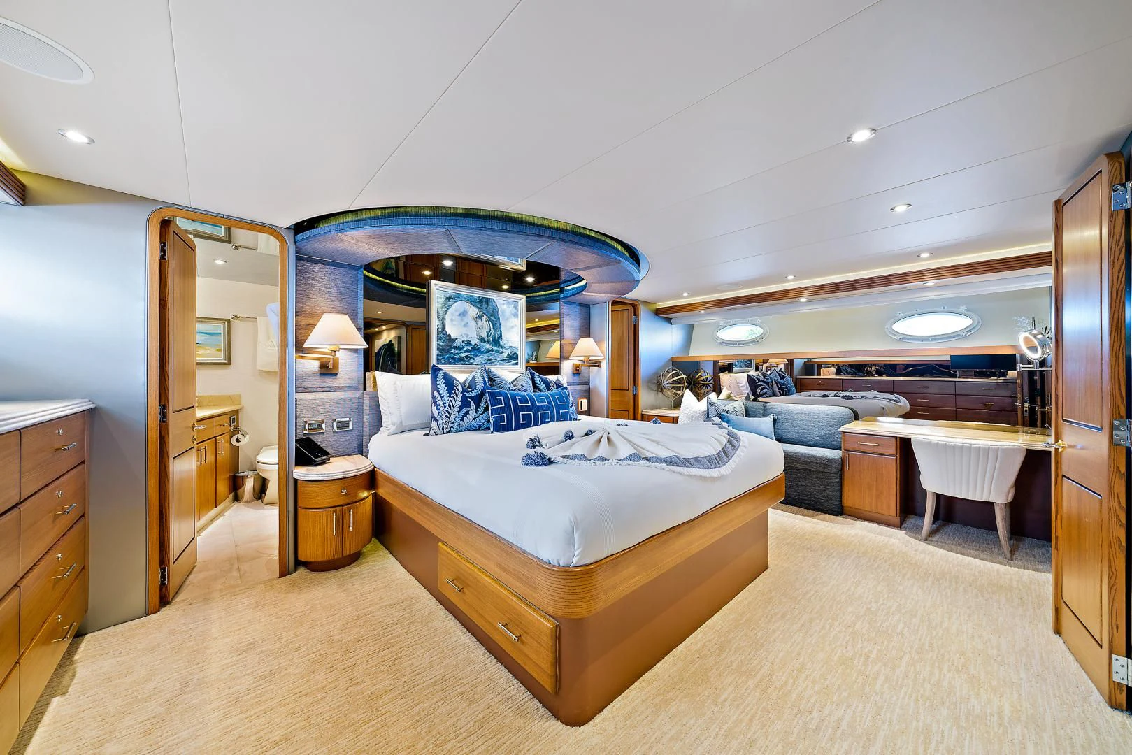 a bedroom with a bed and a couch aboard SUPERSTAR Yacht for Charter
