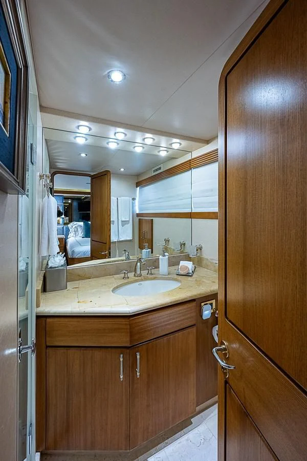 a bathroom with a sink and a mirror aboard SUPERSTAR Yacht for Charter