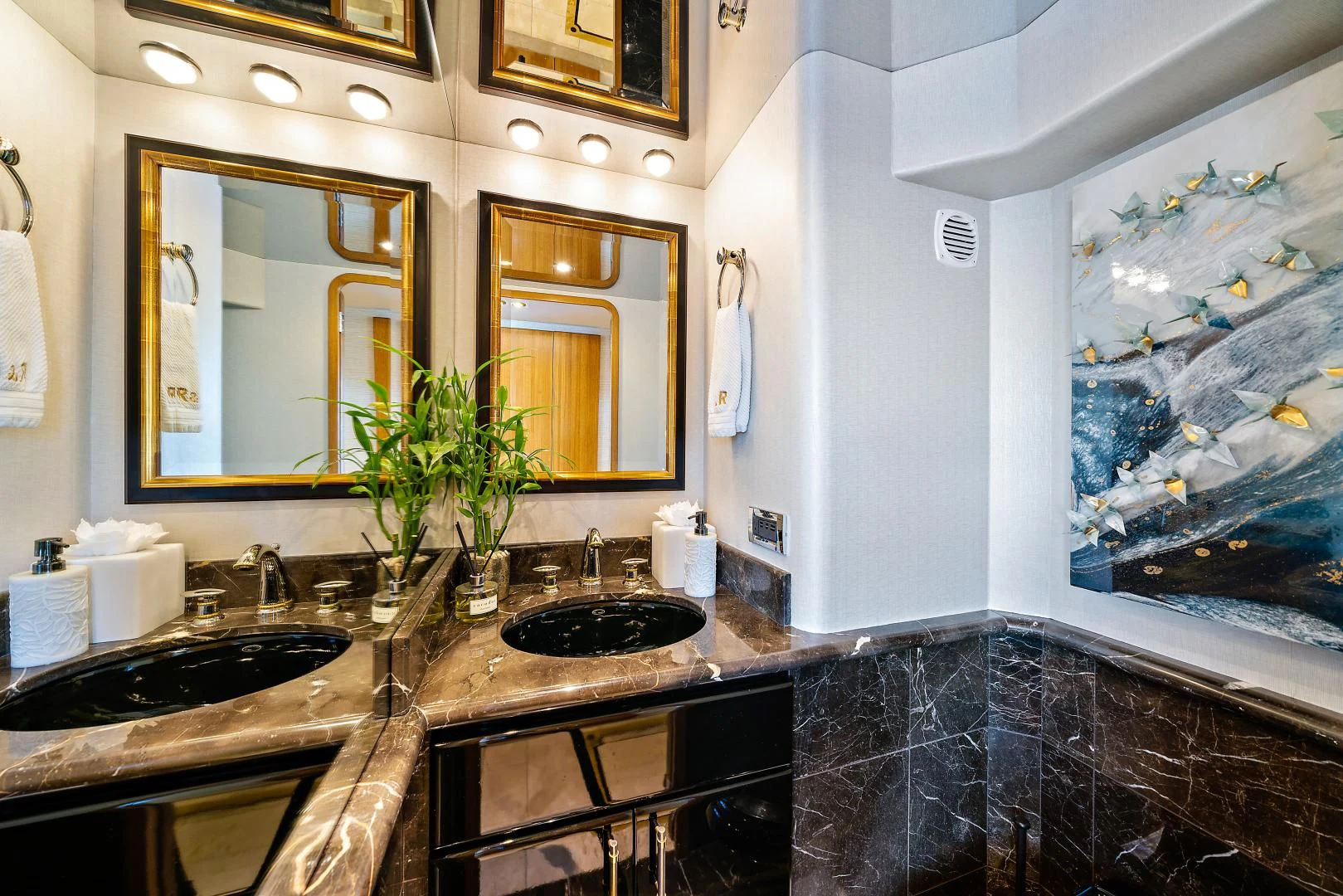 a bathroom with a marble counter top aboard SUPERSTAR Yacht for Charter