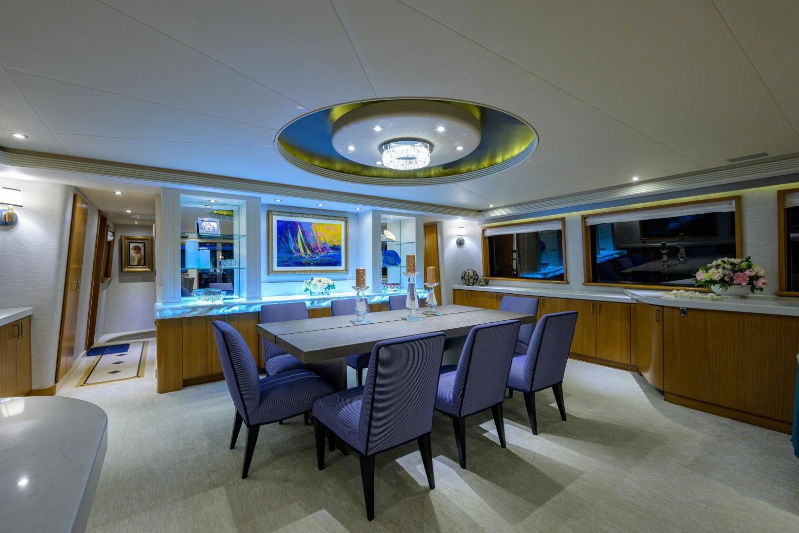 a large room with a round table and chairs aboard SUPERSTAR Yacht for Charter
