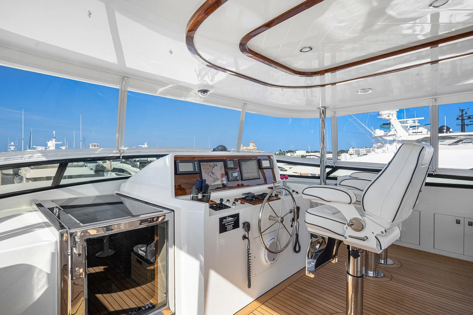 a room with a chair and a table with chairs aboard SUPERSTAR Yacht for Charter