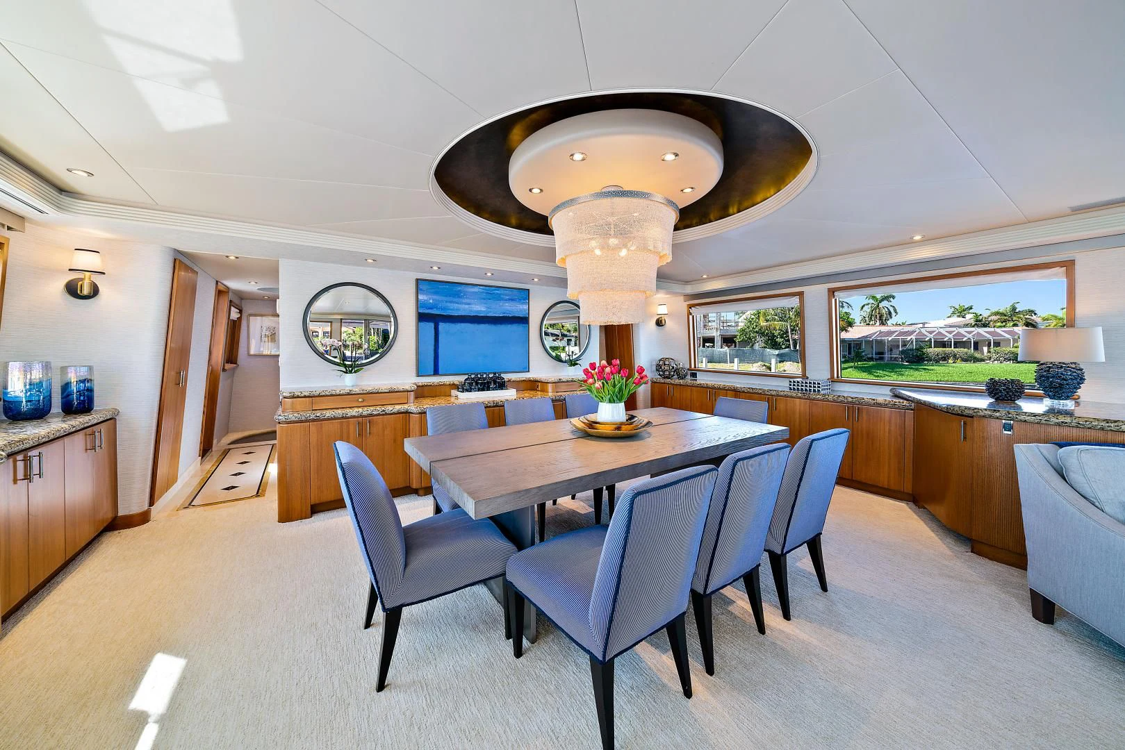 a large kitchen with a table and chairs aboard SUPERSTAR Yacht for Charter