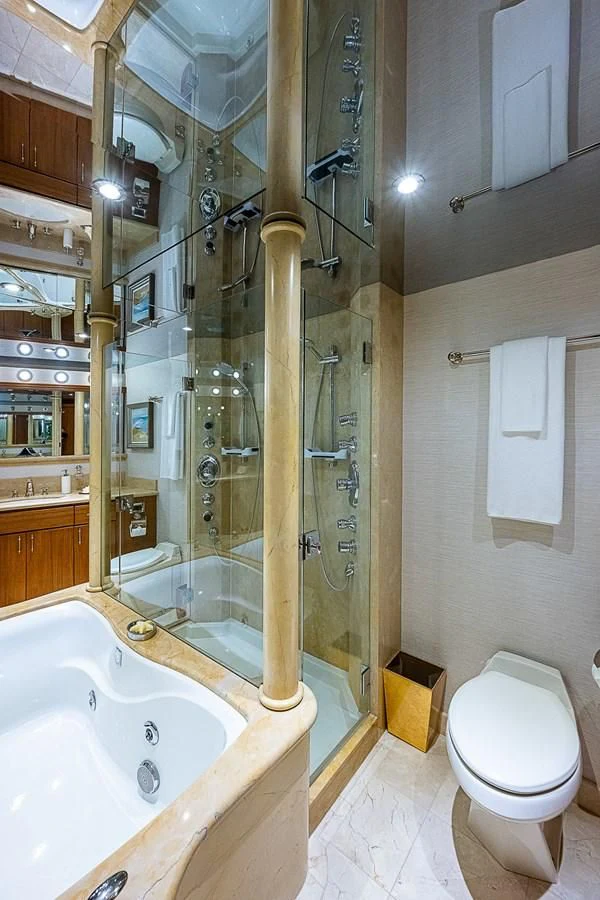 a bathroom with a shower and toilet aboard SUPERSTAR Yacht for Charter