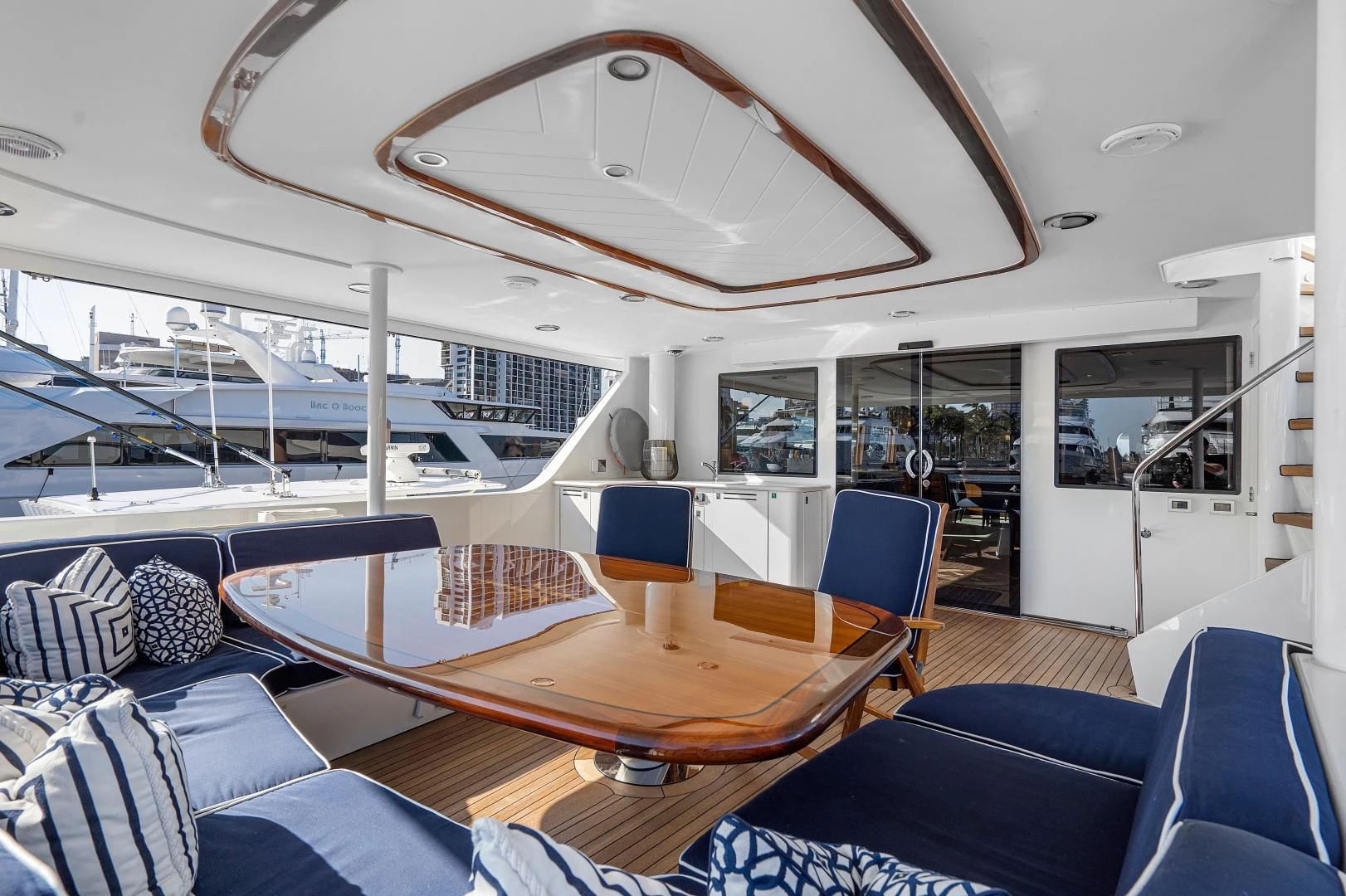 a boat with a table and chairs aboard SUPERSTAR Yacht for Charter