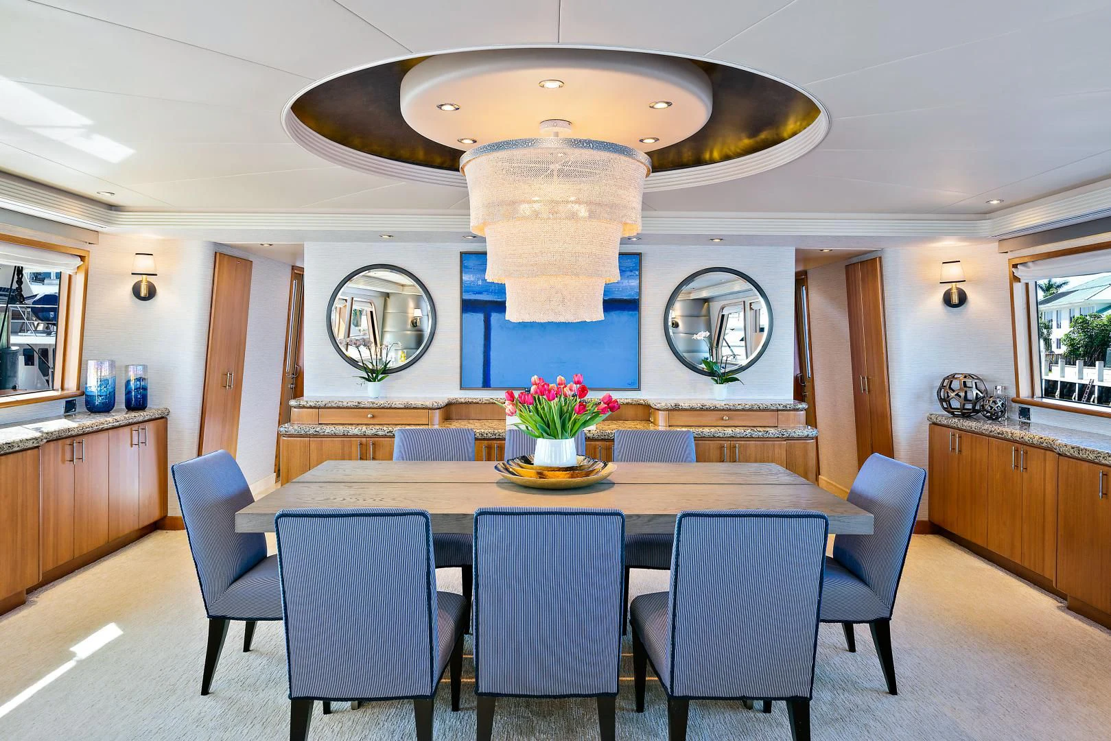 a kitchen with a large table and chairs aboard SUPERSTAR Yacht for Charter