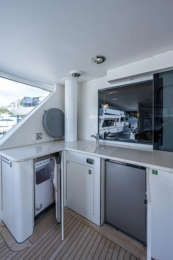 a kitchen with a large window aboard SUPERSTAR Yacht for Charter