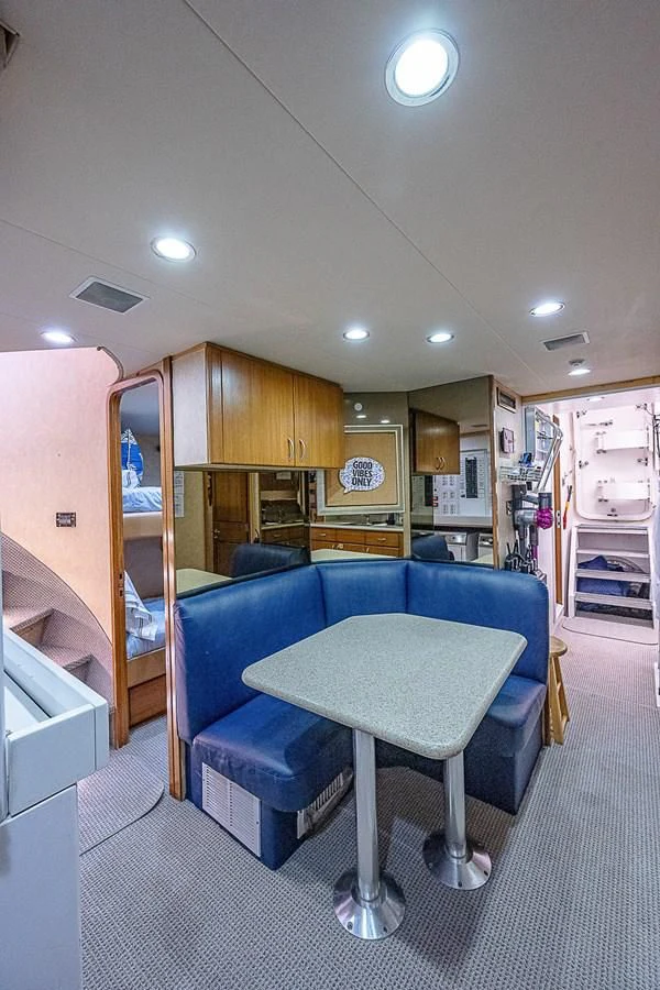 a blue chair in a room aboard SUPERSTAR Yacht for Charter