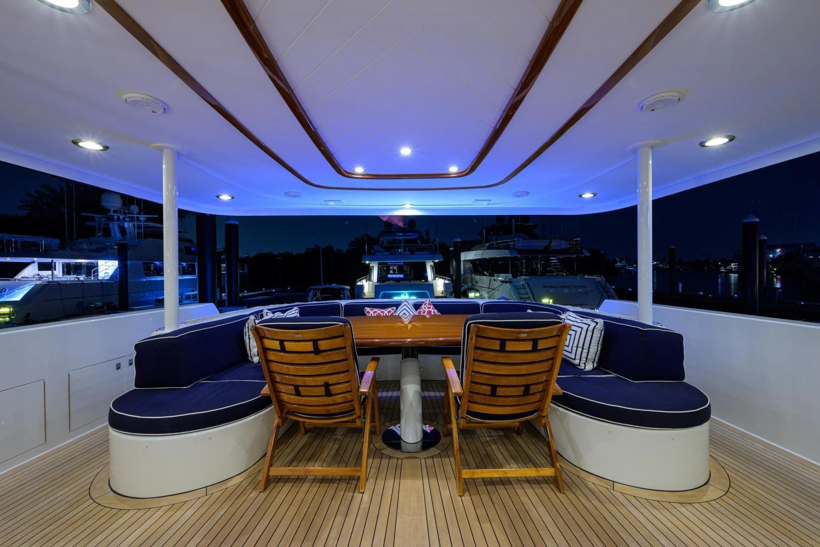 a pool table and chairs in a room with a table and chairs aboard SUPERSTAR Yacht for Charter