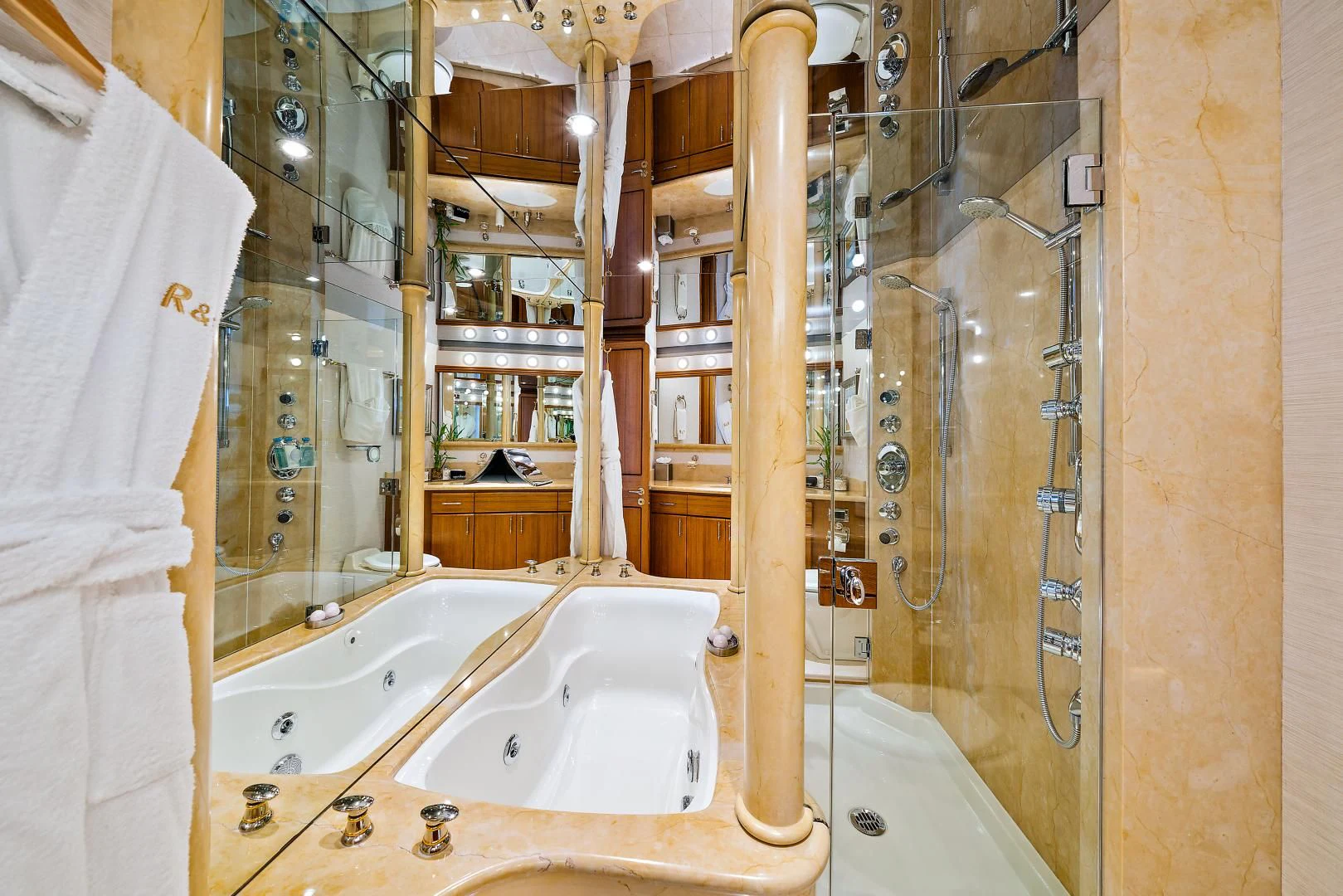 a bathroom with a tub and shower aboard SUPERSTAR Yacht for Charter