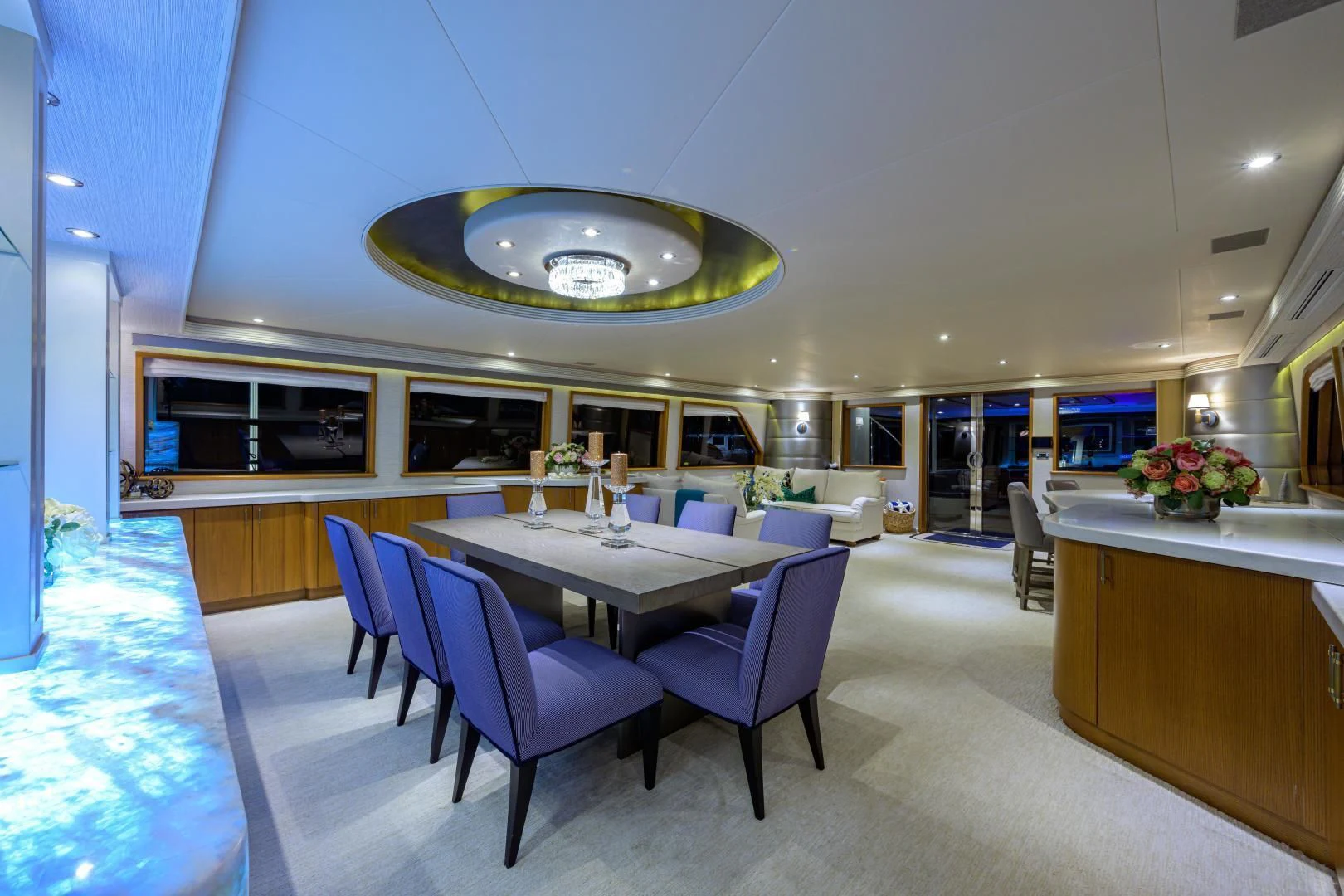 a large room with a table and chairs aboard SUPERSTAR Yacht for Charter