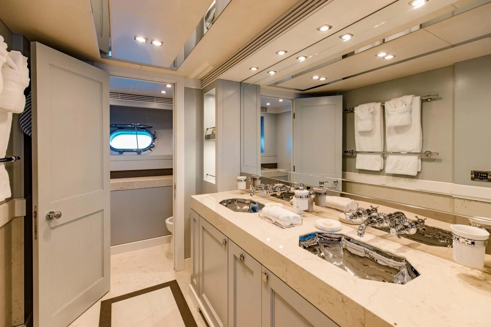 a bathroom with a large mirror aboard TAYRONA Yacht for Sale