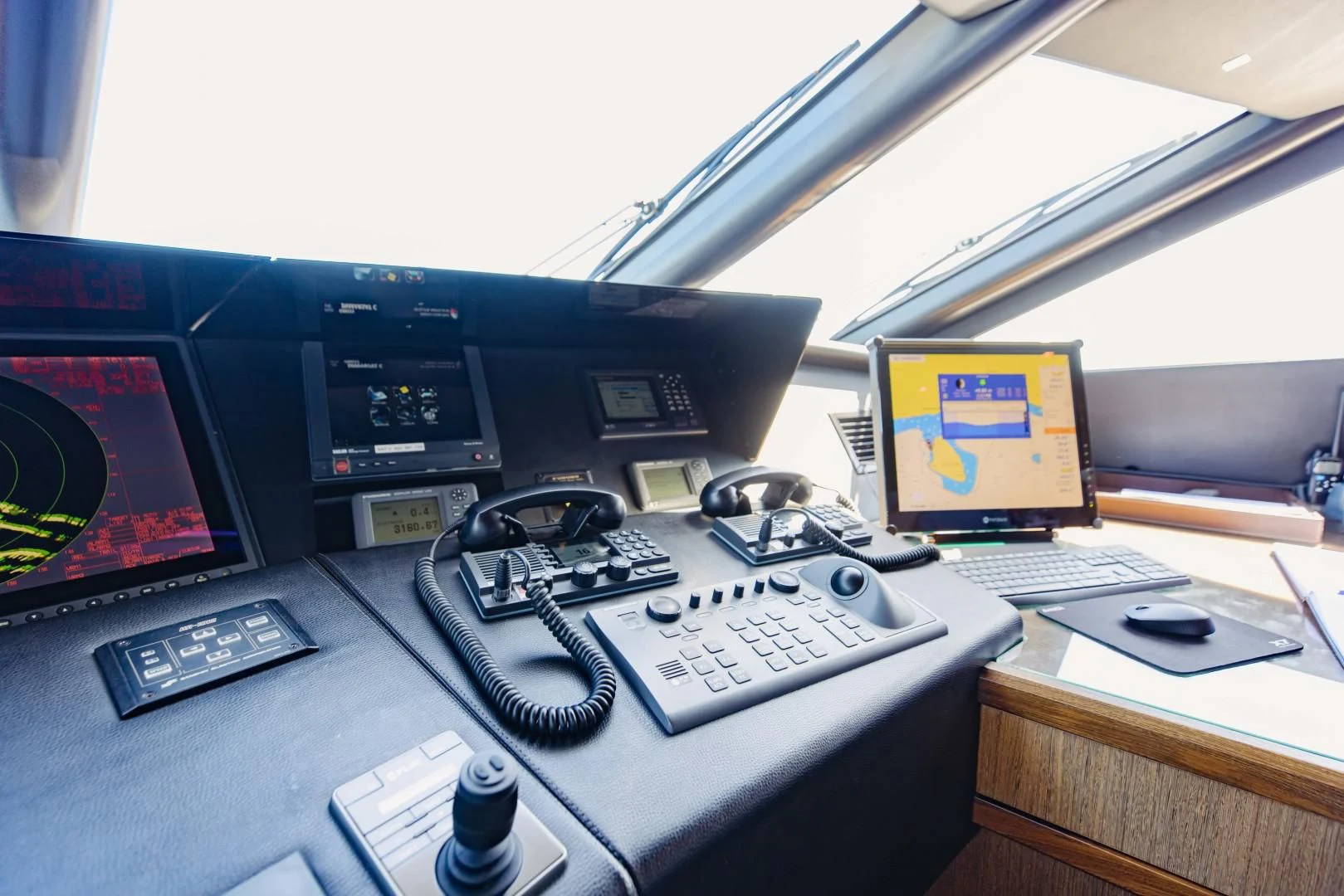 a desk with a laptop and a keyboard aboard TAYRONA Yacht for Sale