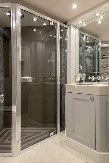 a bathroom with a glass shower aboard TAYRONA Yacht for Sale