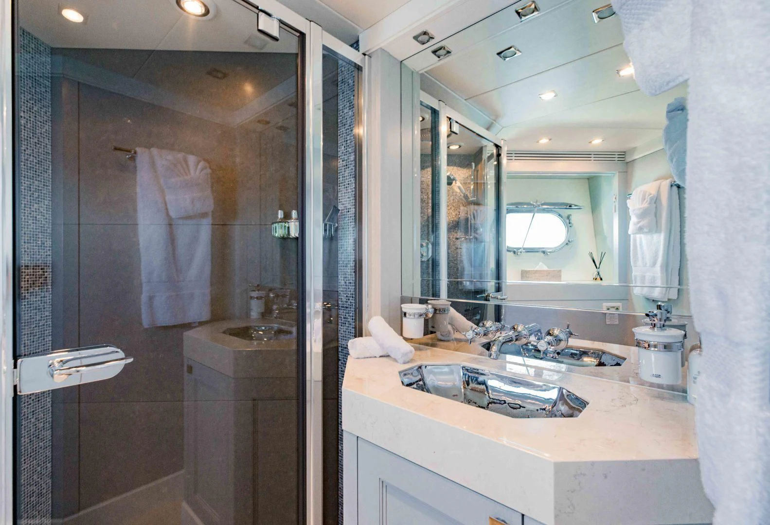 a bathroom with a large mirror aboard TAYRONA Yacht for Sale