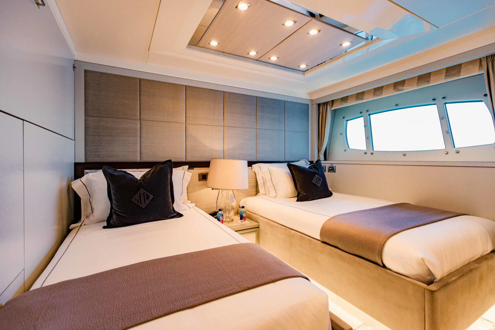 a couple of beds in a hotel room aboard TAYRONA Yacht for Sale