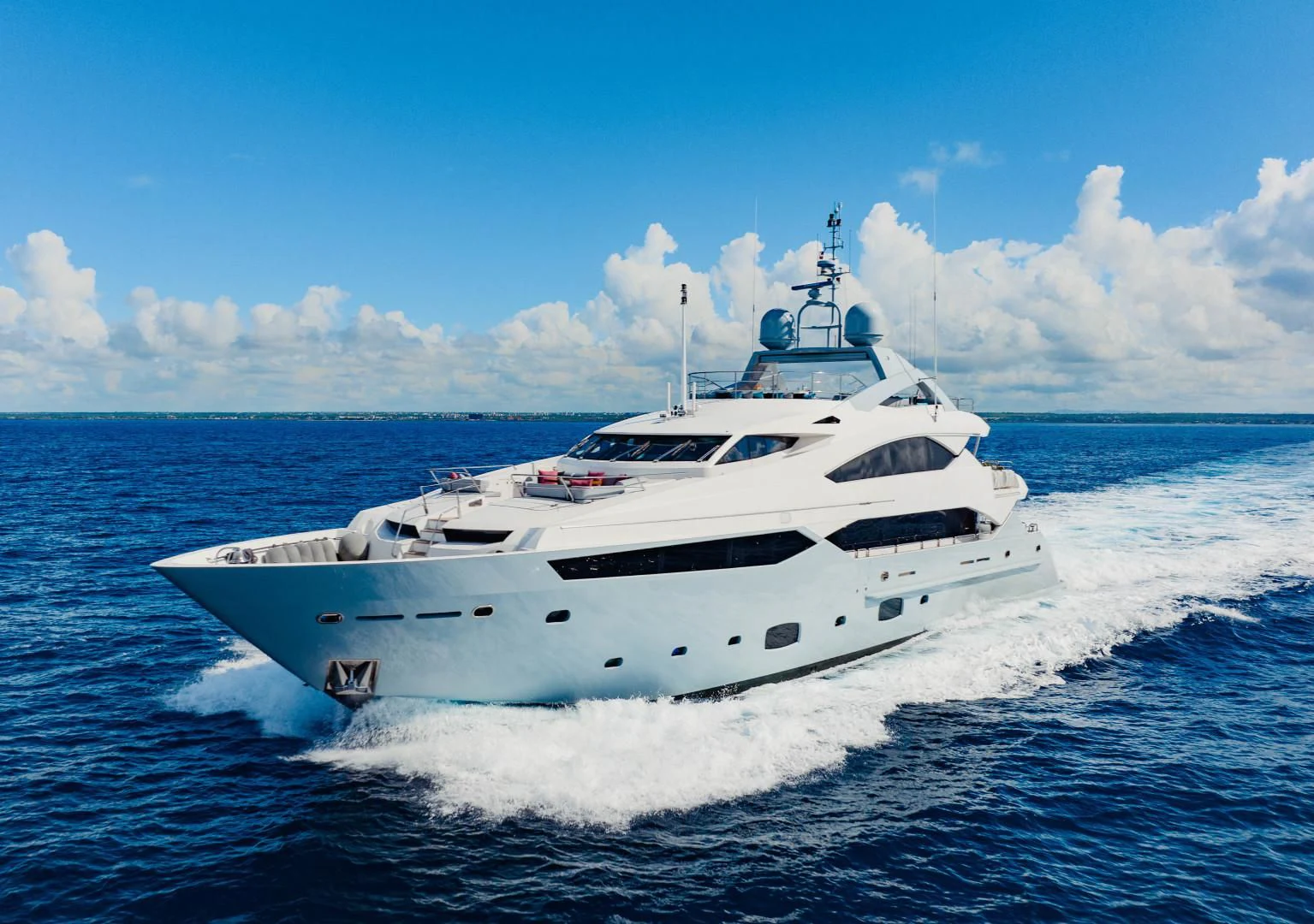 a white yacht on the water aboard TAYRONA Yacht for Sale