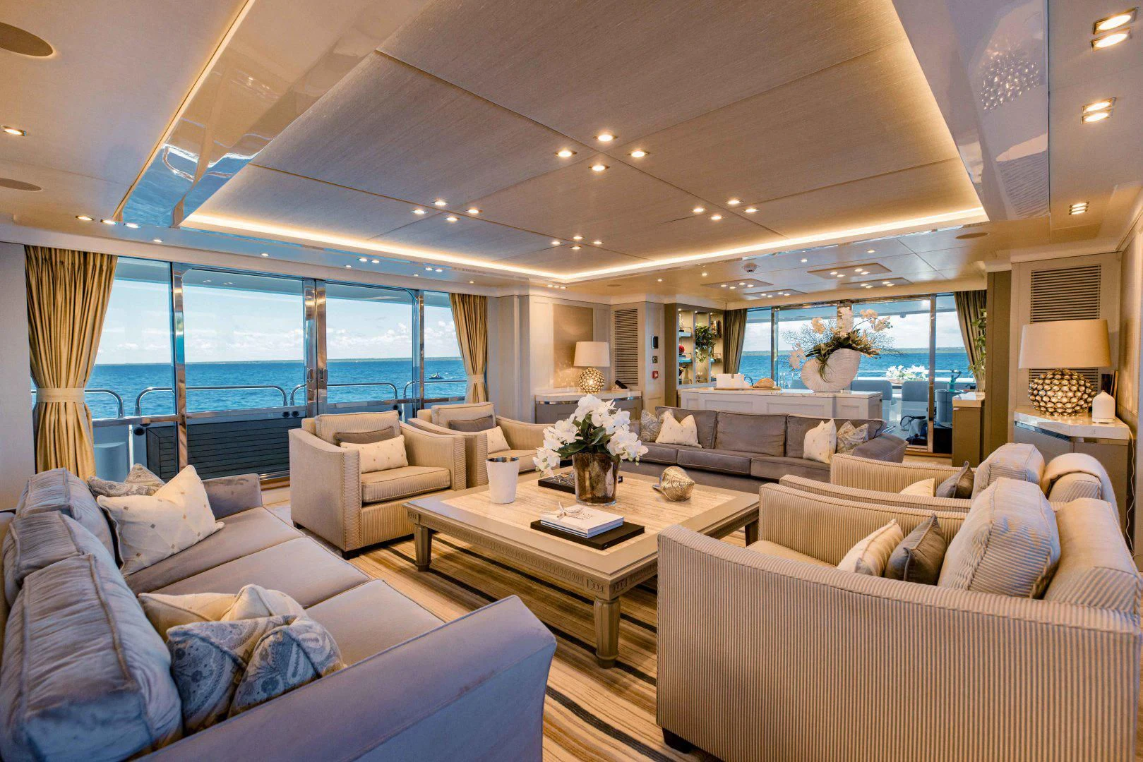 a living room with a large window aboard TAYRONA Yacht for Sale