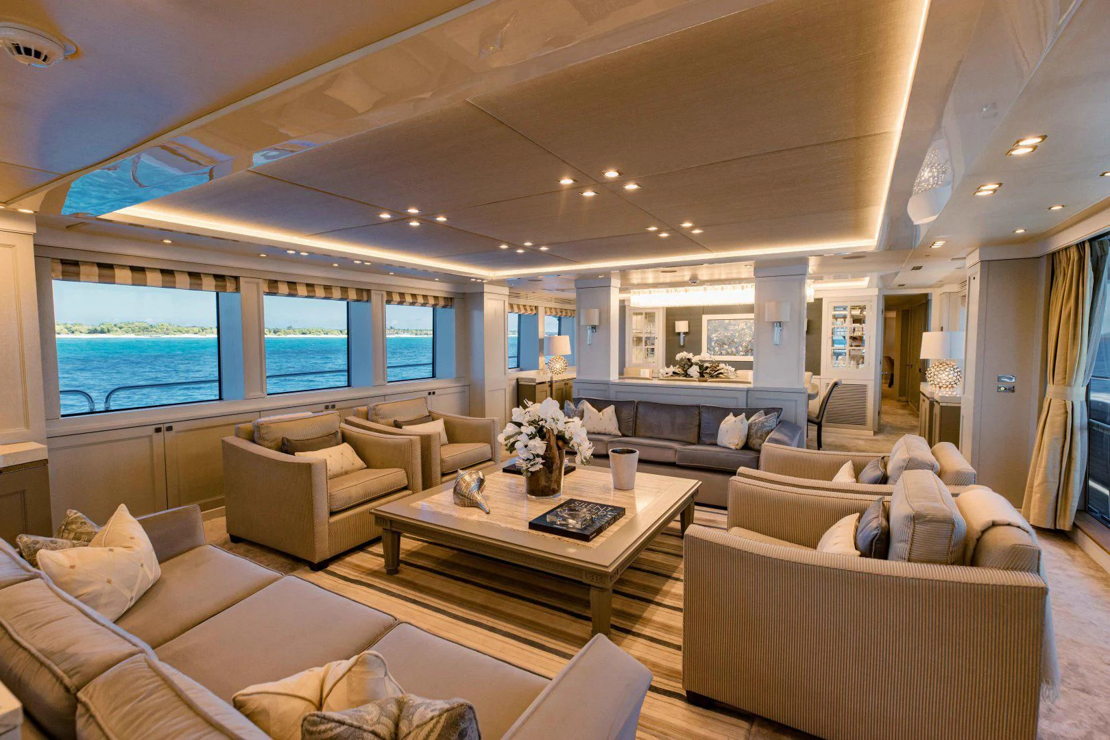a living room with a large window aboard TAYRONA Yacht for Sale