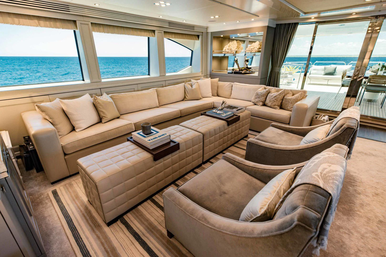 a living room with a couch and a coffee table aboard TAYRONA Yacht for Sale