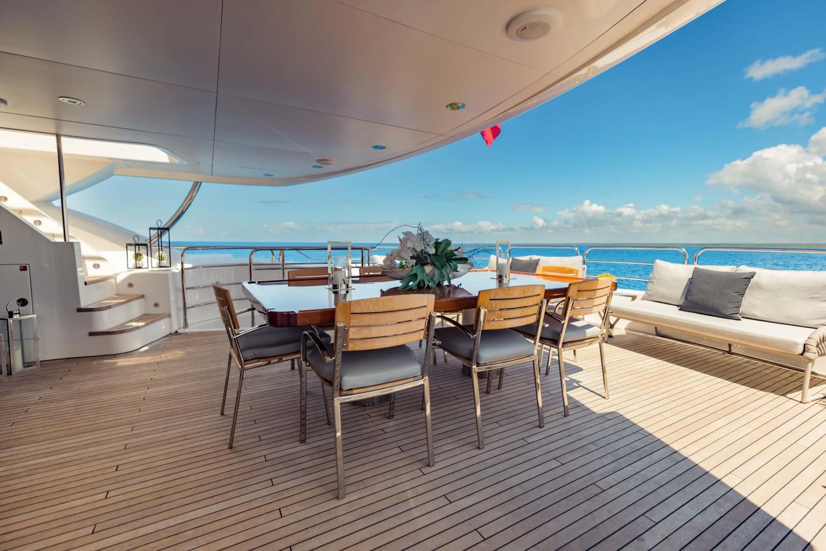 a room with a table and chairs aboard TAYRONA Yacht for Sale