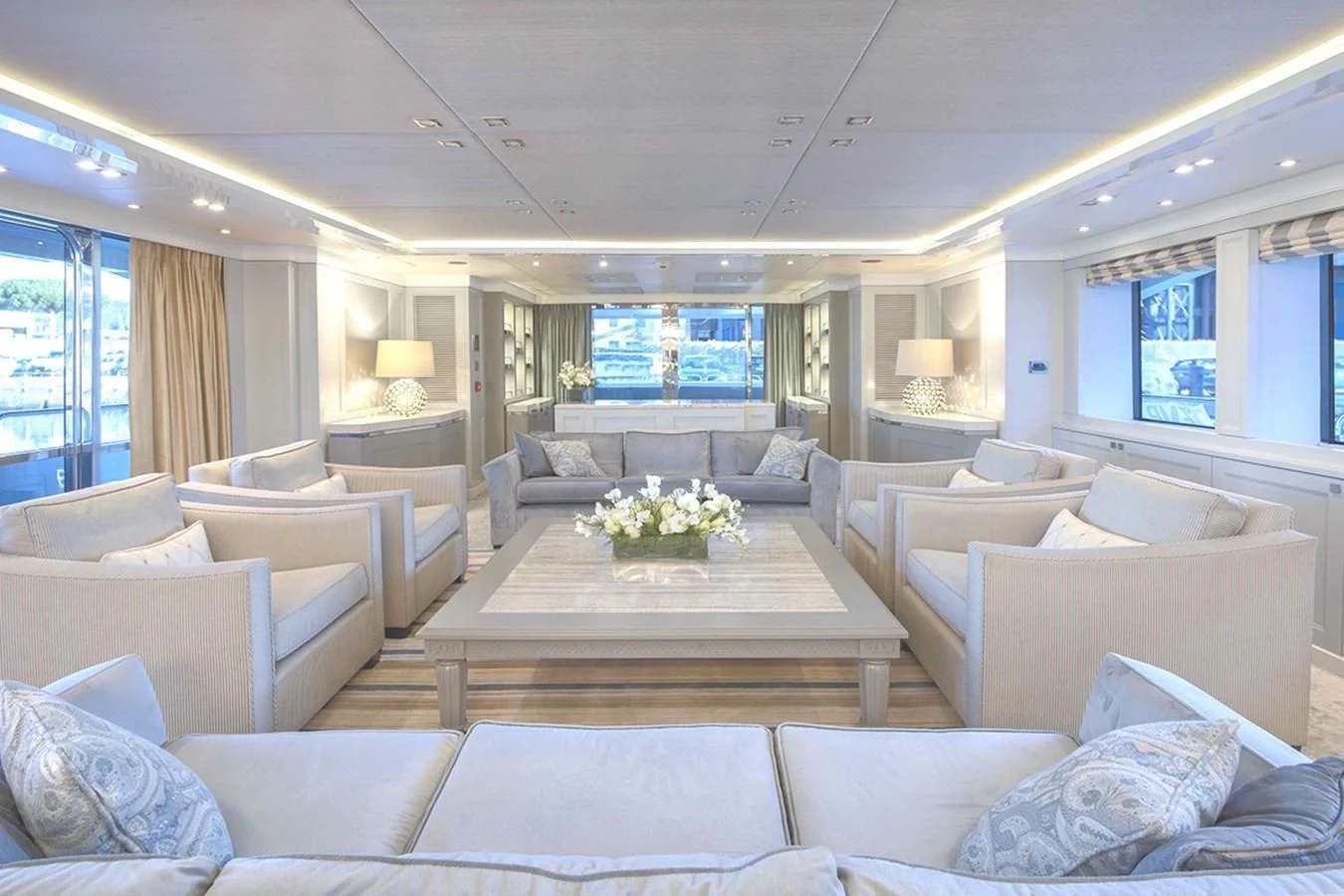 a living room with a large window aboard TAYRONA Yacht for Sale