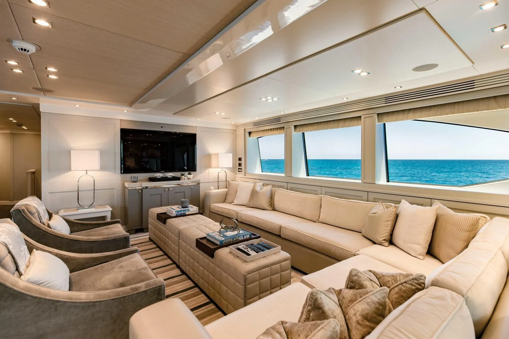 a living room with a large window aboard TAYRONA Yacht for Sale