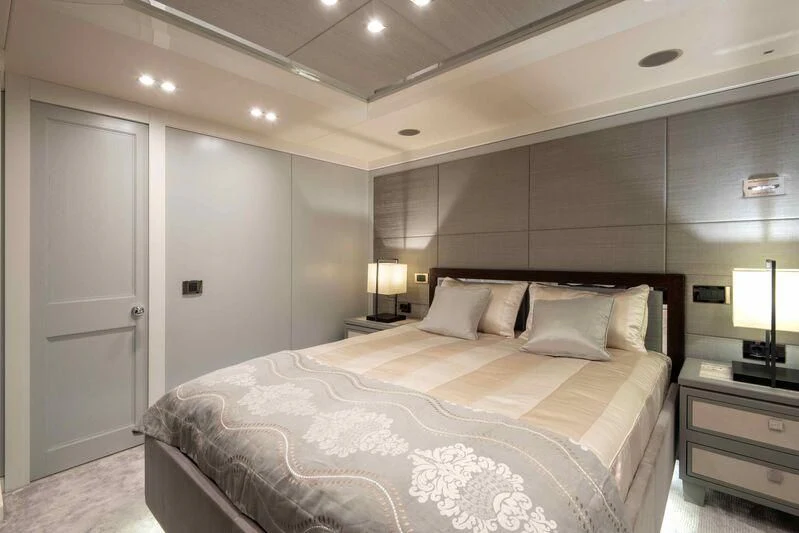 a large bed in a hotel room aboard TAYRONA Yacht for Sale