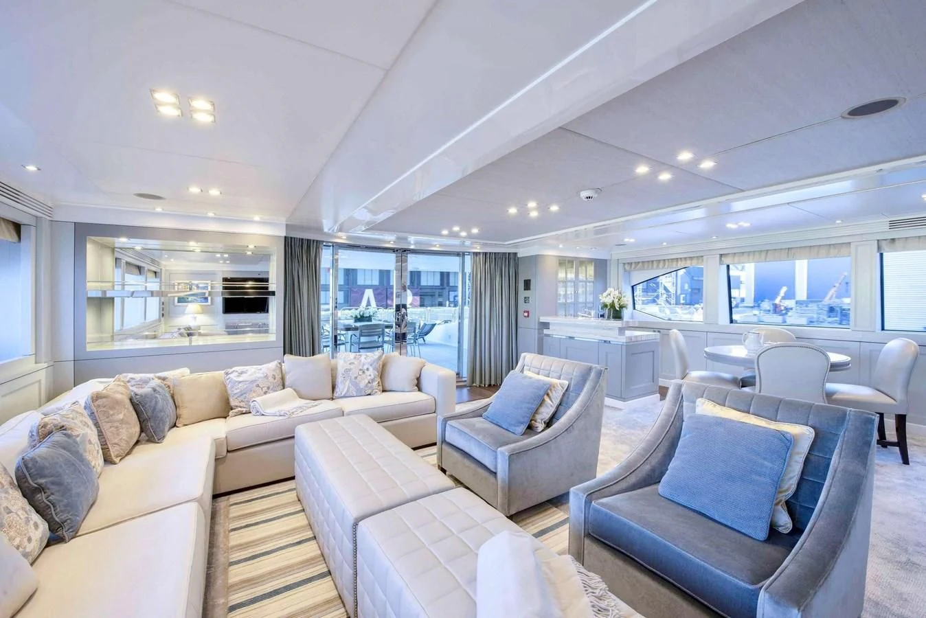 a living room with a couch and a table aboard TAYRONA Yacht for Sale