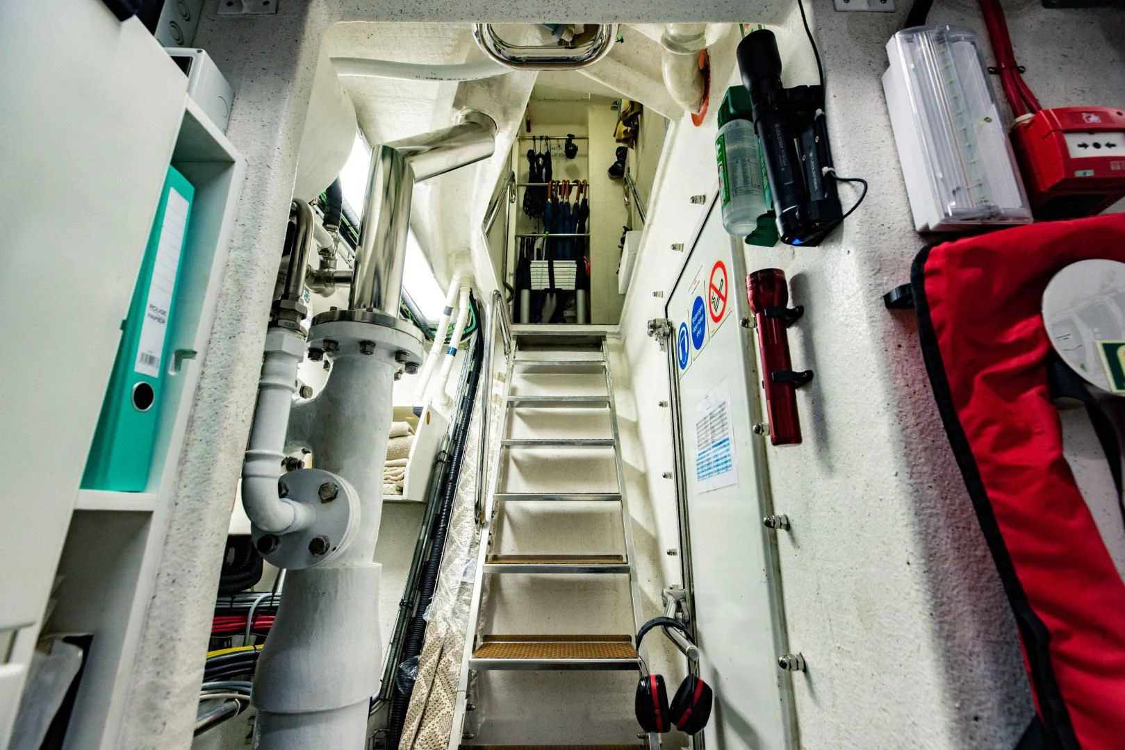 a hallway with a set of stairs aboard TAYRONA Yacht for Sale