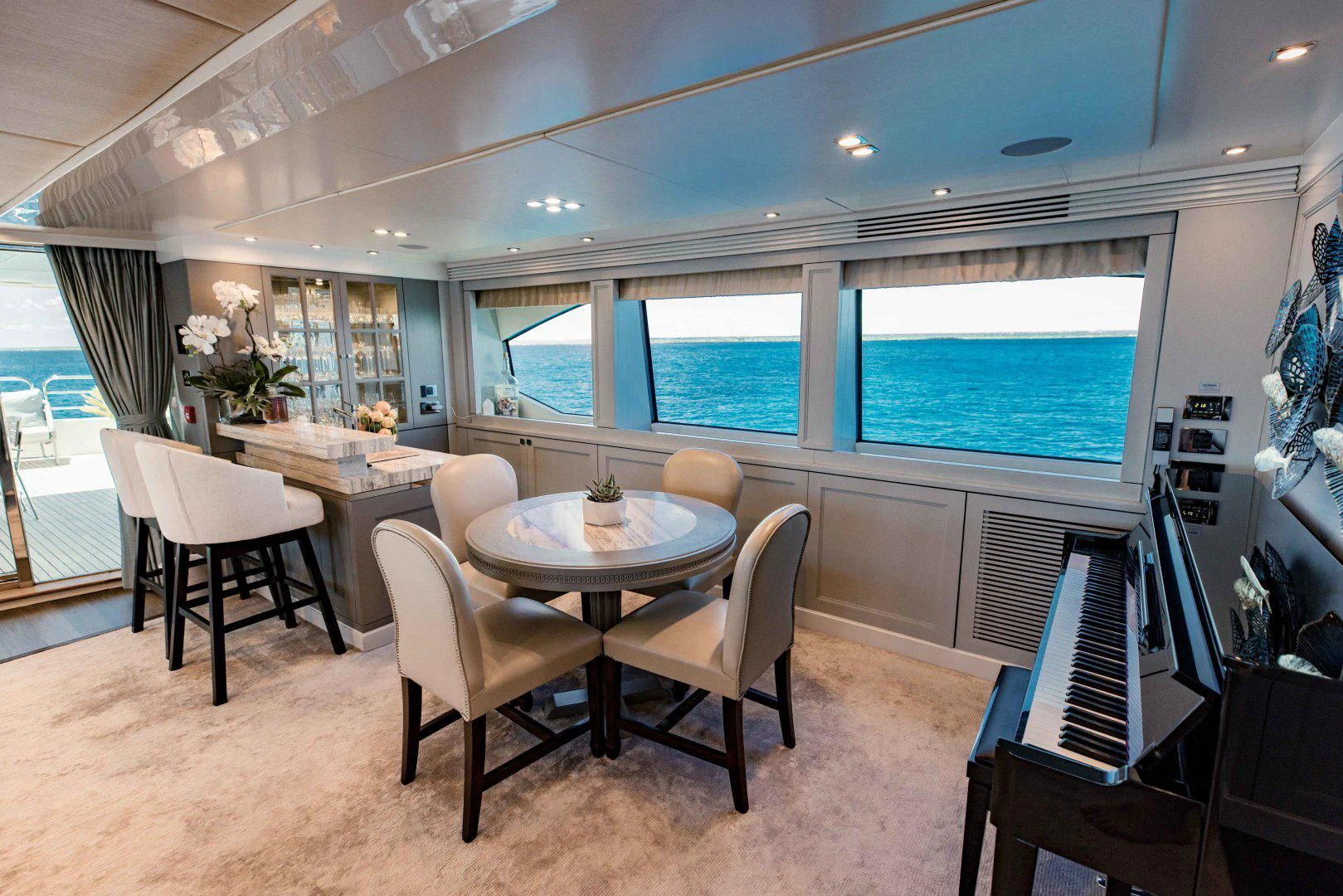 a room with a table and chairs aboard TAYRONA Yacht for Sale