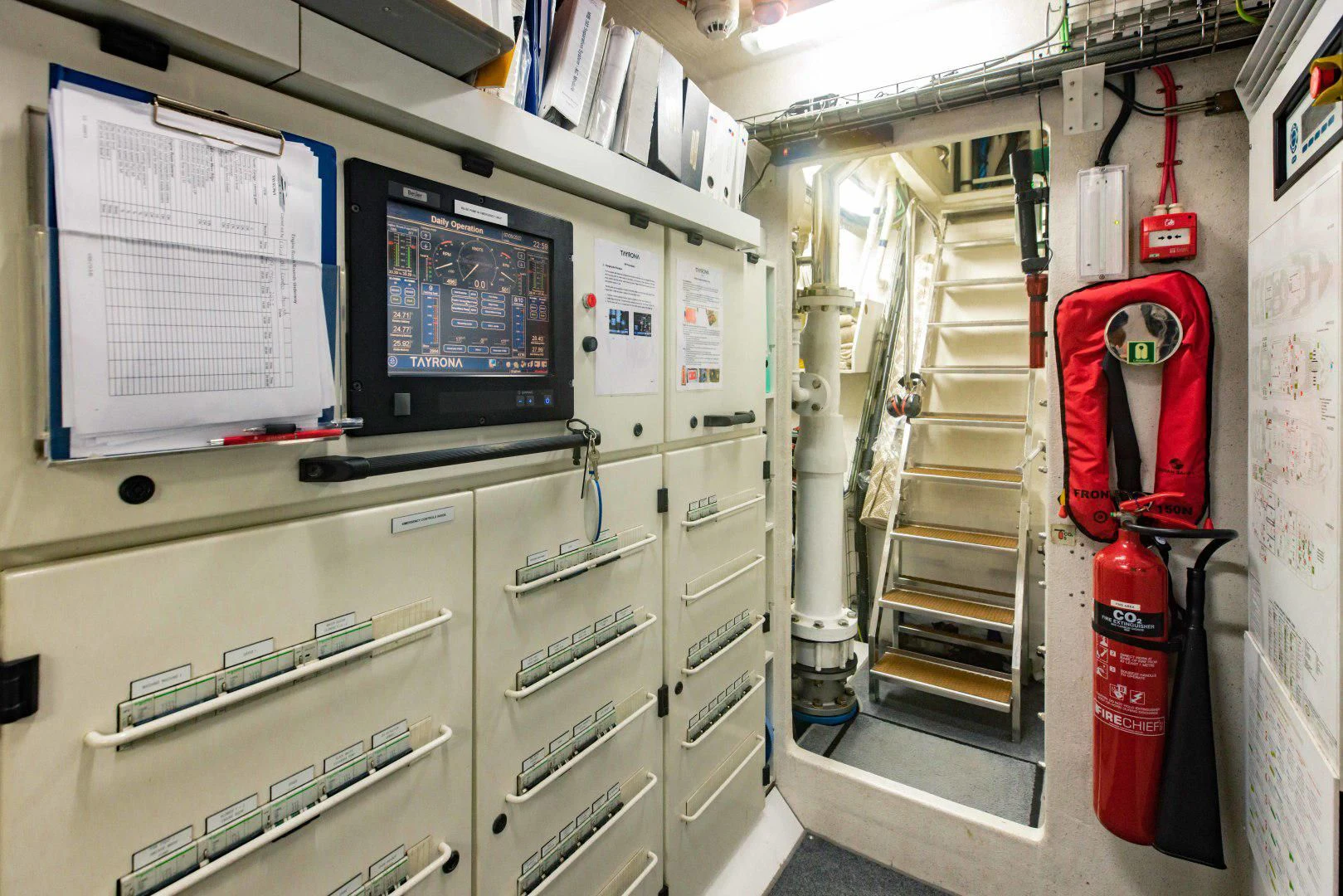a room with a computer and a ladder aboard TAYRONA Yacht for Sale