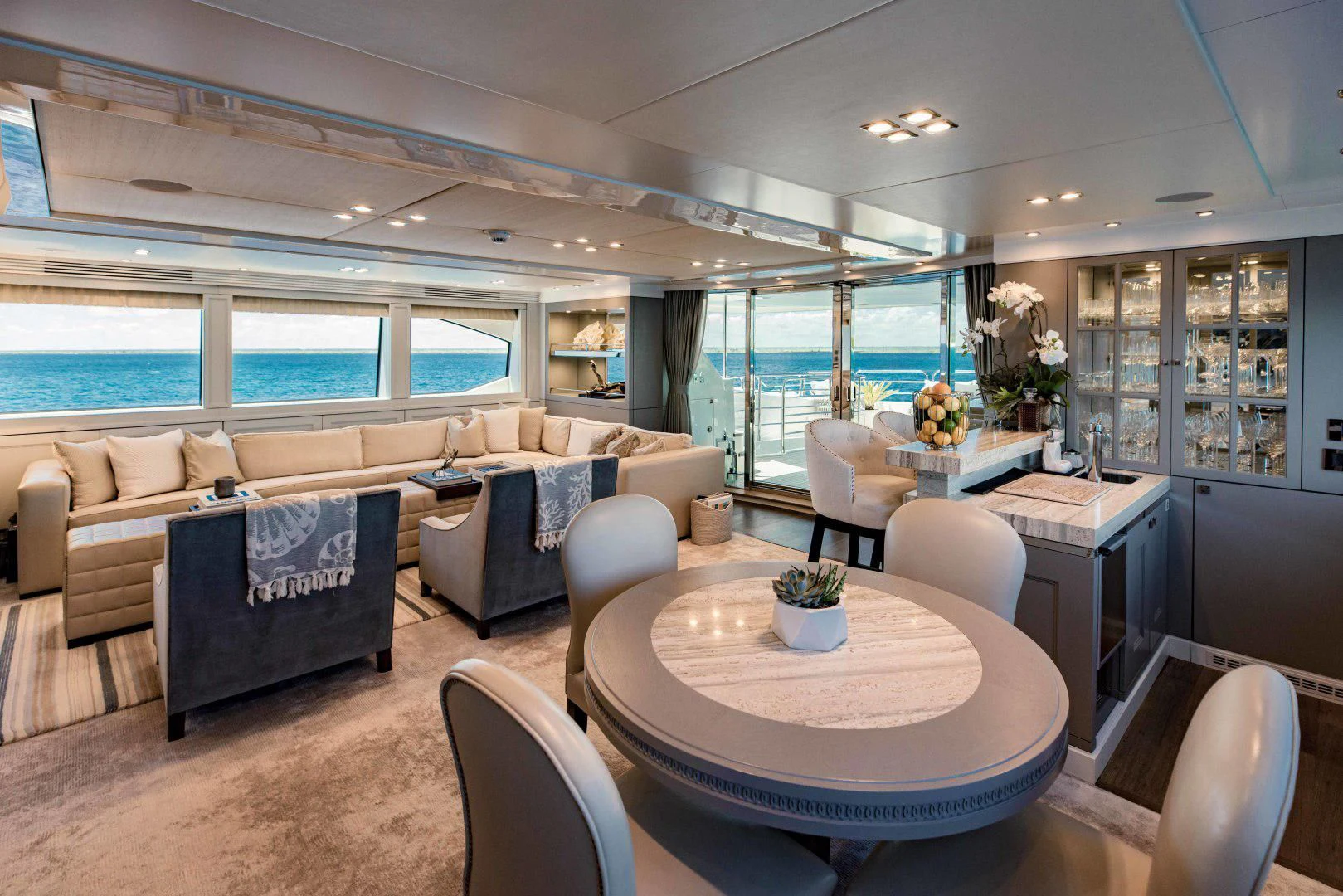 a living room with a large window aboard TAYRONA Yacht for Sale