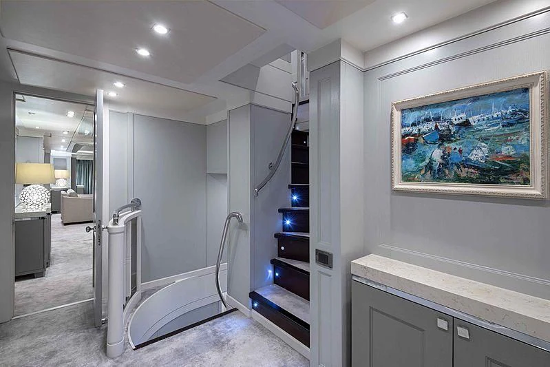 a white staircase in a room aboard TAYRONA Yacht for Sale