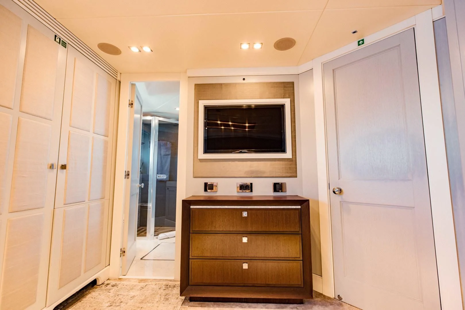 a room with a tv and a cabinet aboard TAYRONA Yacht for Sale