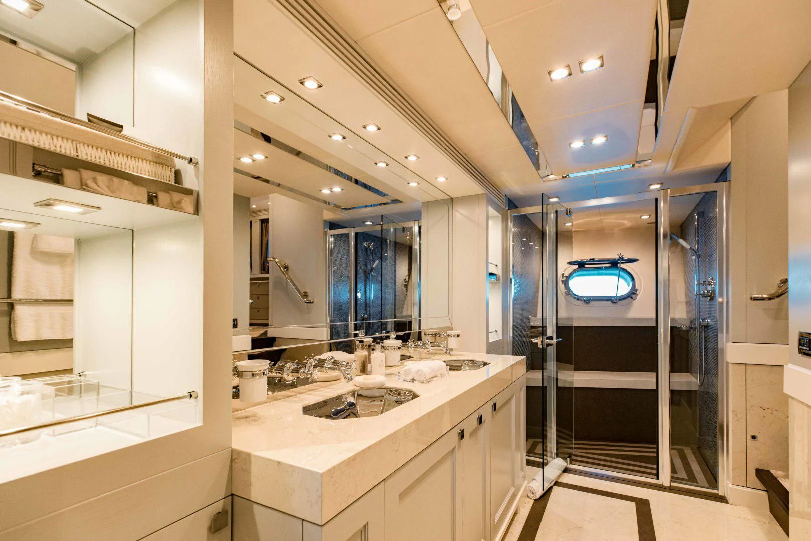 a bathroom with a large mirror aboard TAYRONA Yacht for Sale