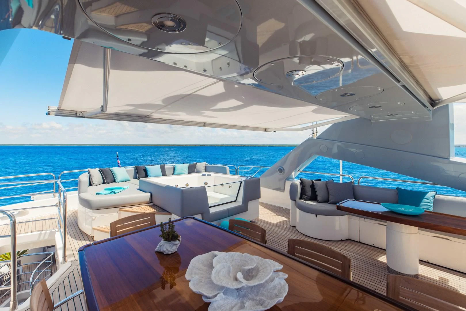 a boat with a table and chairs aboard TAYRONA Yacht for Sale