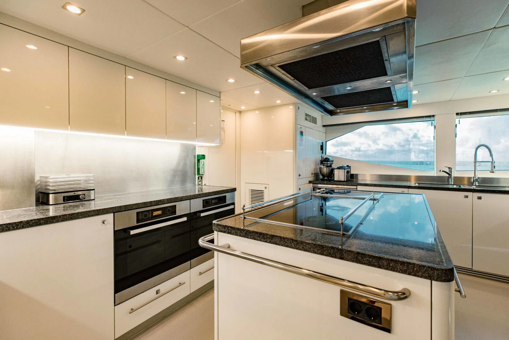 a kitchen with a microwave oven aboard TAYRONA Yacht for Sale