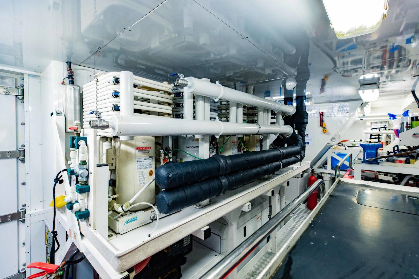 a large white machine in a factory aboard TAYRONA Yacht for Sale