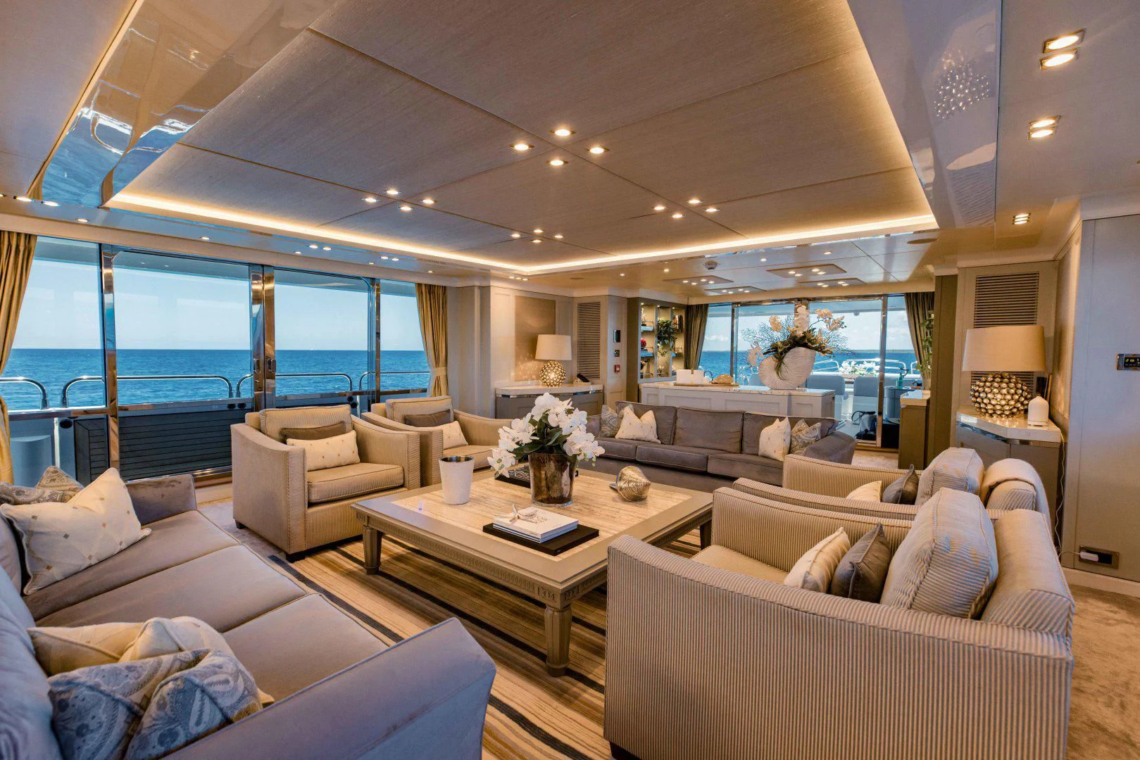 a living room with a large window aboard TAYRONA Yacht for Sale