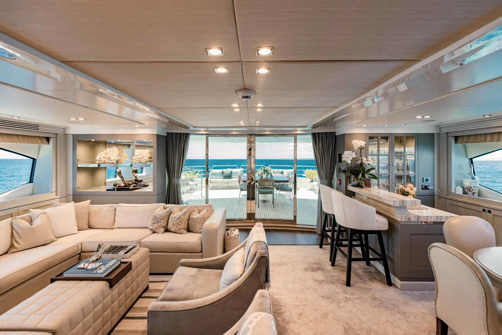 a living room with a couch and a table aboard TAYRONA Yacht for Sale