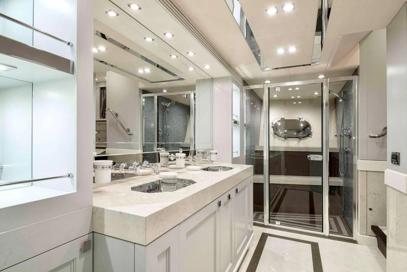 a bathroom with a sink and a mirror aboard TAYRONA Yacht for Sale