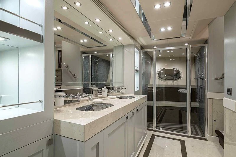 a bathroom with a sink and a mirror aboard TAYRONA Yacht for Sale