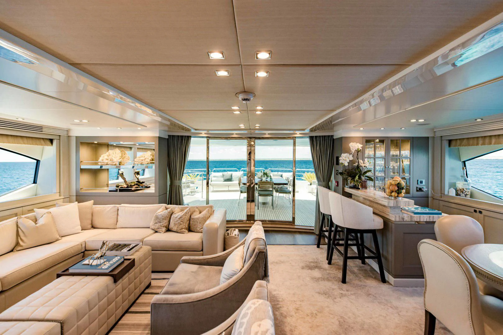 a living room with a couch and a table aboard TAYRONA Yacht for Sale