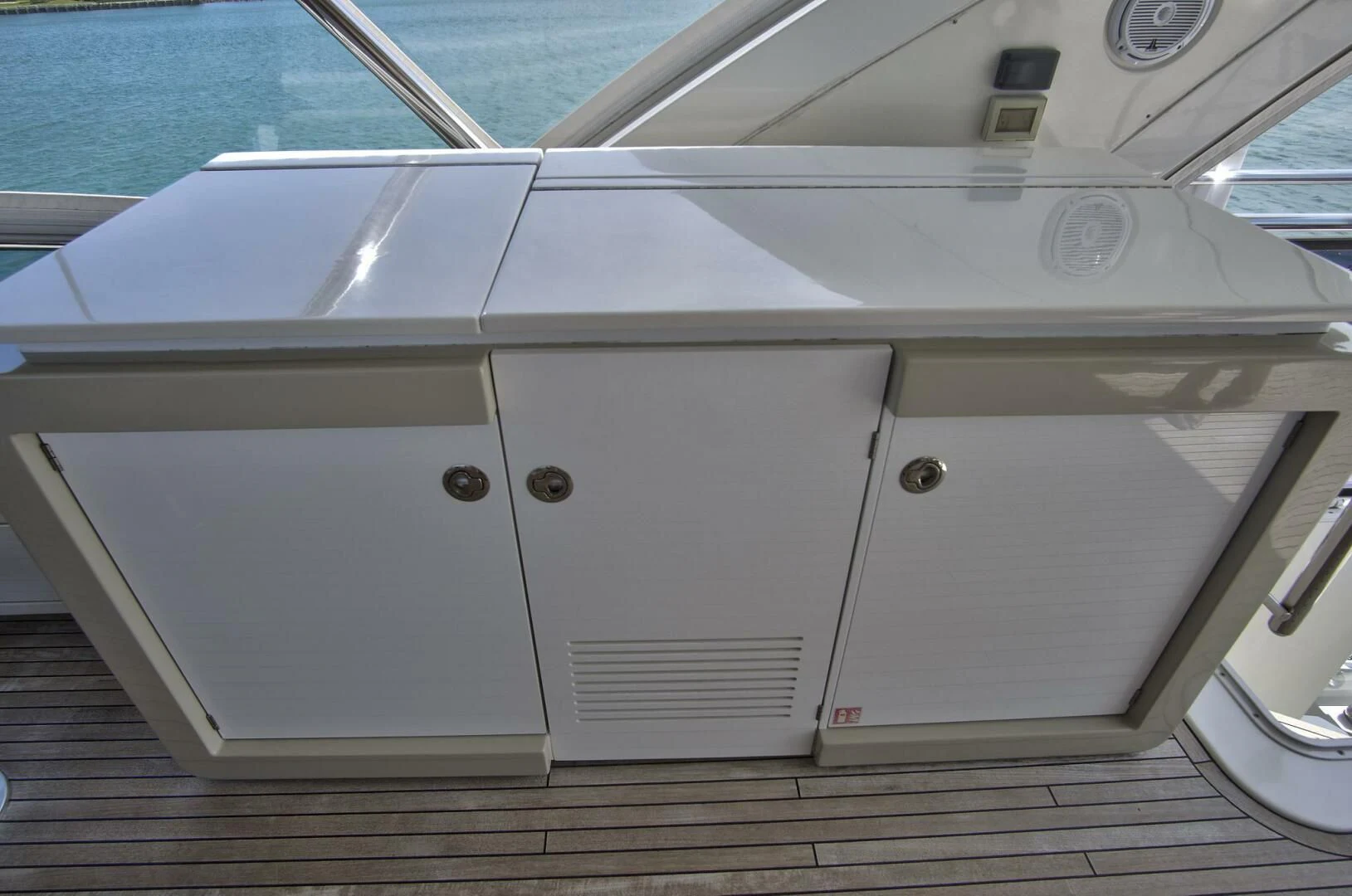 a white rectangular object on a wooden surface aboard GRATITUDE Yacht for Sale